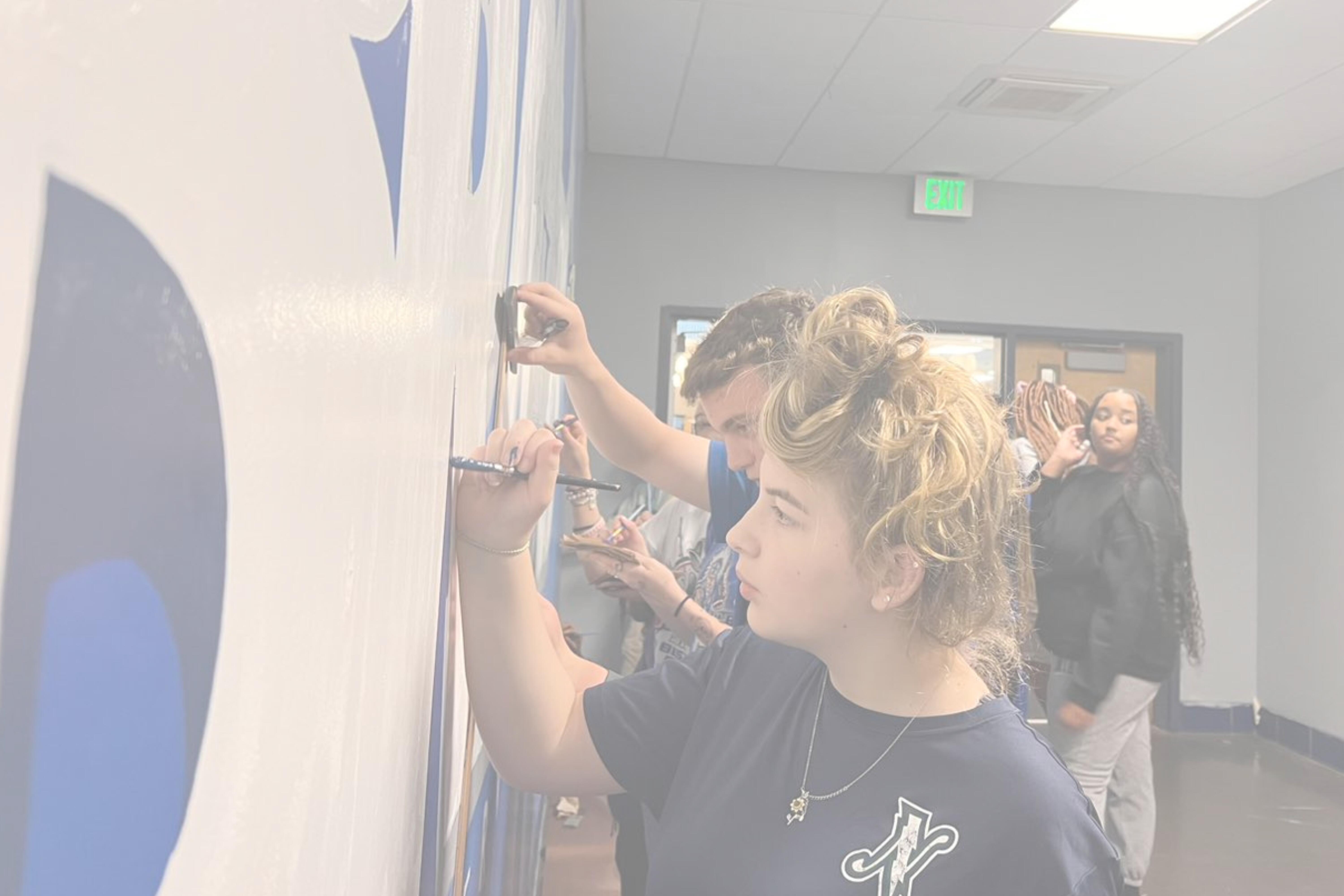 Student painting the wall