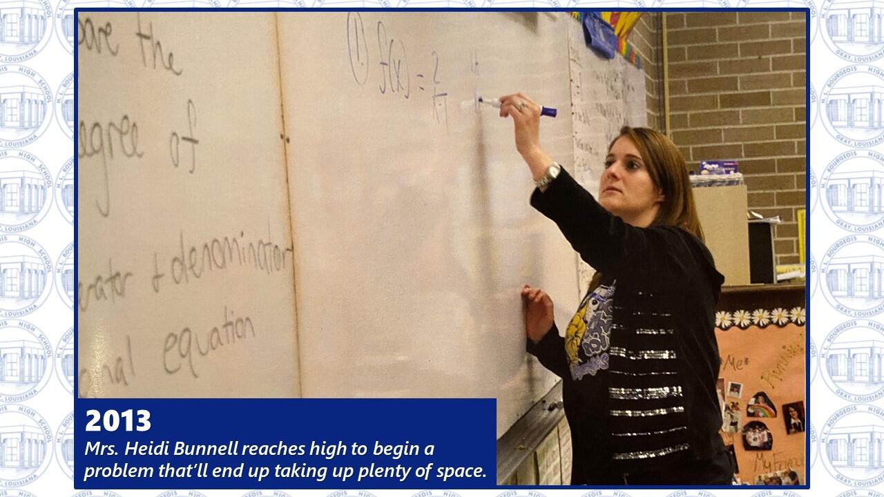 Mrs. Bunnell writes an equation. 