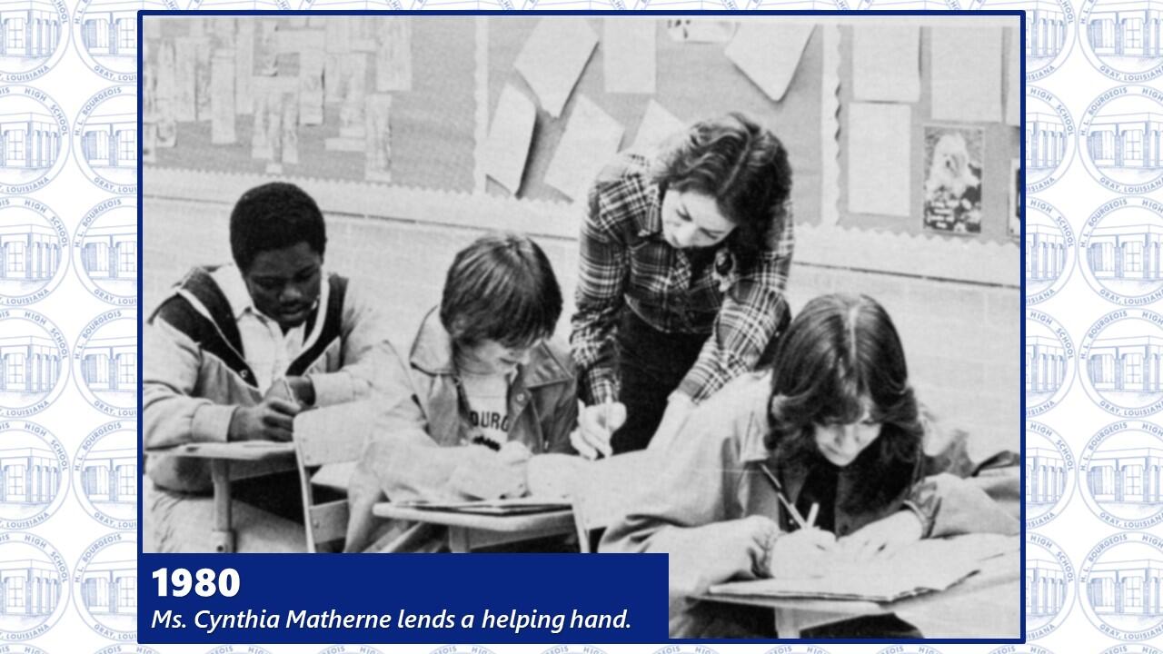 Picture of Ms. Matherne helping students