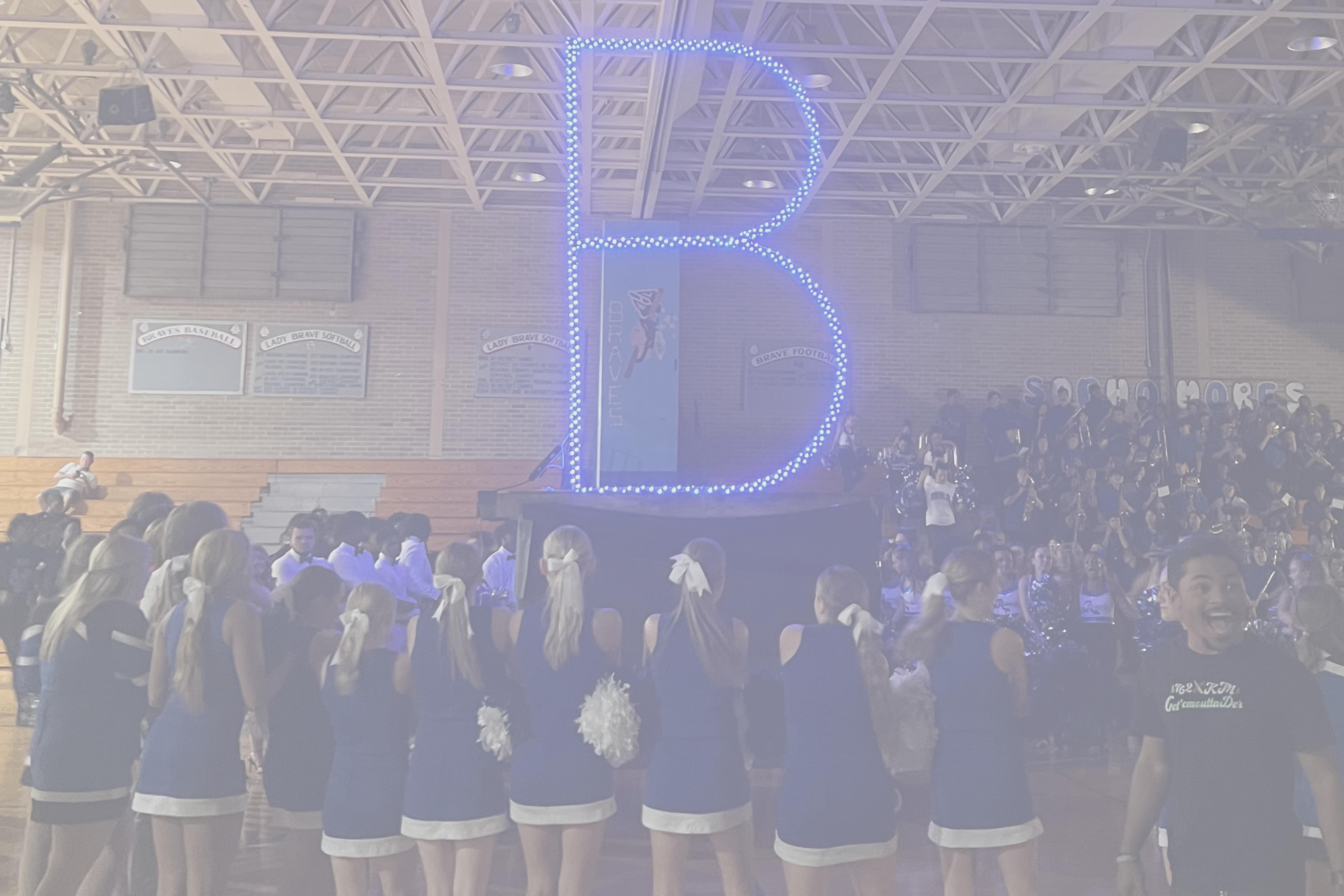 Students surrounding "B"